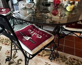 Mosaic tile top table with glass and 4 chairs.