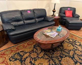 Navy blue sofa and chair with ottoman. Oval coffee table