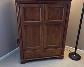 53 by 42 inch Ethan Allen entertainment cabinet with 27 inch Sony TV (Trinitron).