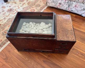 wooden chest with river rock and shells