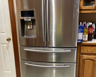 Samsung Smart refrigerator with extra crisper drawer, plus ice and water on the door