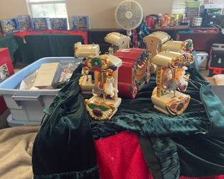 Christmas inspired Sheep dog carousel with music box. Dogs go up and down on the carousel - terribly charming!