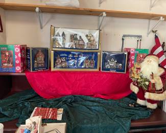 Many Christmas villages and Santas