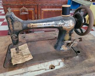 old singer sewing machine with the ornate cast iron base and 2 drawers