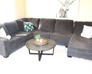 Charcoal gray sectional sofa. Showing some slight wear. Sections: left-96" W, middle 64" W, right lounger 36" W x 72" L.  BUY IT NOW!  $195.00.