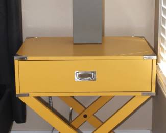 Pair of X-base wood accent campaign tables, in banana yellow color. BUY IT NOW!  $200.00                                       Pair of gray lamps with white shades. BUY IT NOW! $50.
