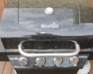 Charbroil four burner propane gas grill with two propane tanks. BUY IT NOW!   $100.00