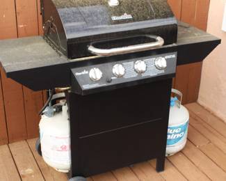Charbroil four burner propane gas grill with two propane tanks. BUY IT NOW!   $100.00