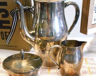 Paul Revere Reproduction Set - With Pineapple Top.  This is a great set by Oneida Silversmiths.  This is Silverplate and could use a good polish to bring out its true beauty.  This set does have a very minor blemish to the creamer that can be easily repaired.