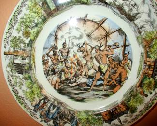 Plate depicting  Native Americans bought ready to get rid of a European Intruder while Indian maiden pleads for his life .