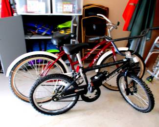  Kids bikes used by occasional visiting grand children. Boat kayak life jackets in cabinet. Cabinets for sale also.