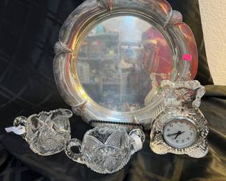 Silver plated trays, crystal pieces, and the bear clock is by Waterford and retired