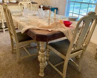 Dining room table and six chairs. Table has two leaves. The set was refinished in the 1960s. The chairs need to be recovered.