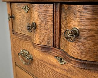Antique Six-Drawer Oak Chest of Drawers with Serpentine Top & Brass Pulls. Measures 33" W x 20" D x 45" H. Photo 2 of 3.