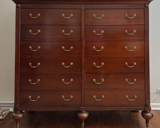 Lort Manufacturing Cherry 12-Drawer Double Chest of Drawers with Brass Pulls And Turned Wood Legs on Casters. Photo 1 of 3.