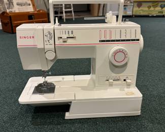 Singer Sewing Machine. Photo 1 of 2.