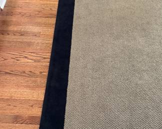 Wool Area Rug with Black Trim.