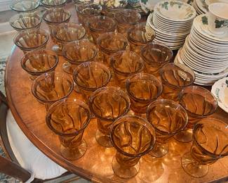 Large set of amber jamestown swirl glasses