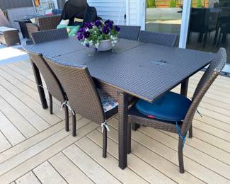 Patio table w/6 wicker chairs, (small damage on right side of tabletop),  $399