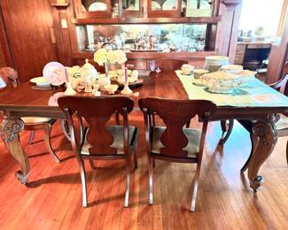 Antique carved leg dining table with two leaves. This item is available for pick up after the sale of the house. Available for purchase the days of the sale.