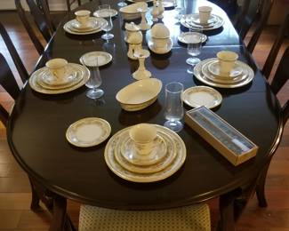 Incredible Ethan Allen mahogany dining room table with 8 chairs, 2 arms and 6 sides.
Very reasonably priced. 