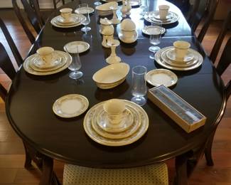 Incredible Ethan Allen mahogany dining room table with 8 chairs, 2 arms and 6 sides.
Very reasonably priced. 