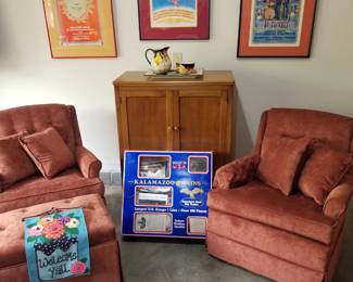 Swell pair of swivel chairs and super authentic vintage posters. Garage. 