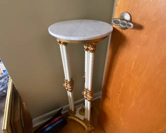 Ornate marble-topped stand -- three footed