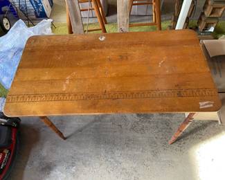 Sewing table with yardstick at the top