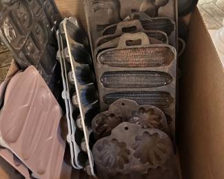 Vintage cast iron molds and corn bread pans