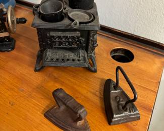 Cast iron toy irons and stove