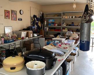 Full garage with lots of goodies, books, vinyl records, frames, pots and pans 