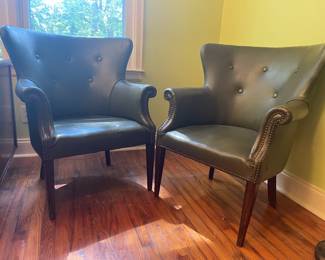 Pair of leather Arm Chairs with nailhead 