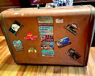 Vintage suitcase with city stickers 