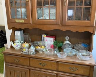China hutch with many collectible pieces of china and crystal.  Noritake, Homer Laughlin, to name a few.