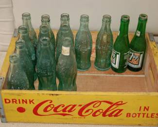 Vintage Coca-Cola bottles and crate