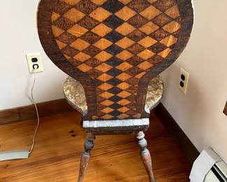 Checkered pattern on back of the chair 