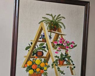 Framed stitched plant artwork 