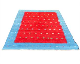 CONTEMPORARY TURKISH FLAT WOVEN CARPET | Central red field with a vibrant blue border - l. 152 x w. 116 in.
