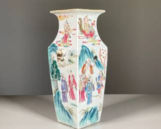 FAMILLE ROSE PORCELAIN SQUARE VASE | Showing procession of figures offering gifts to a dignitary with gods depicted in clouds, applied fu dog mask and ring handles
l. 5 x w. 5 x h. 12 in.
