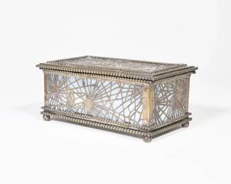 TIFFANY STUDIOS PINE NEEDLE OVERLAY BOX | c. 1907, #815 openwork pine needle pattern over figured opaline glass
The top with engraved dedication along front edge, the underside impressed "Tiffany Studios / New York / 815" 
l. 7 x w. 4 x h. 3 in. (overall)