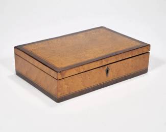 INLAID BIRDS EYE JEWELRY BOX | 19th/20th century
bird's eye maple and inlaid in contrasting woods; fitted with a tiger maple interior.  - l. 10 x w. 6.5 x h. 2.75 in.