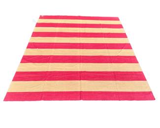 MADELINE WEINRIB AMAGANSETT STRIPED FLAT WOVEN CARPET | Red and tan stripes, purchased new by the consignor and never used - l. 135 x w. 102 in.
