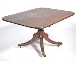 ANTIQUE ENGLISH TILT-TOP BREAKFAST TABLE | 19th century, Rams Head mounted casters, carved quadruped base, turned support. - l. 56.5 x w. 40 x h. 28.5 in.
