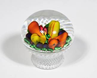 SAINT-LOUIS MILLEFIORI FRUIT BASKET PAPERWEIGHT | Designed as a basket of fruit suspended in a clear crystal orb, base Interior marked "S L 1985" - l. 3 x dia. 3 in. (overall)