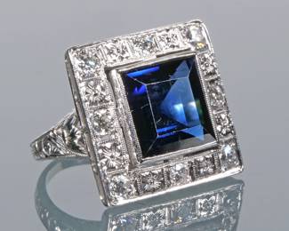 ANTIQUE SAPPHIRE & DIAMOND RING | Designed as a synthetic blue sapphire bezel mounted in a border of colorless melee diamonds in an engraved platinum ring
9.7g
