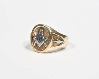 MASONIC 14K GOLD RING | With masonic emblem in an oval reserve with engraved decorated shoulders; size 11.5, 16.2g interior marked "14K / MECCA"