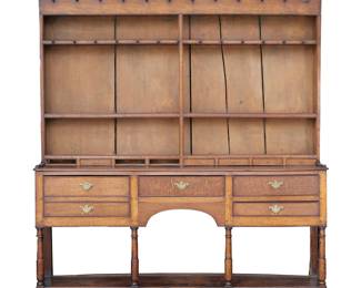 18TH/19TH CENTURY WELSH DRESSER | Three plate racks with two rows of cup hooks over a lower row of 8 small drawers; the lower section with 4 drawers, the left most faux-front double (bottle) drawer.  - l. 74 x w. 16 x h. 83 in.

