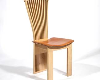 PIETRO CONSTANTINI DINING CHAIR | Top to bottom ladder back with a brown leather seat - l. 18.25 x w. 18 x h. 42.5 in.
