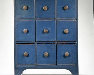 19th C. BLUE PAINTED APOTHECARY CABINET  | Late 19th/ early 20th-century 9-drawer apothecary cabinet painted a rich navy blue, with wooden knob pulls
l. 27 x w. 9.5 x h. 35.5 in.